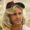 Guy wearing a blonde wig and baseball cap